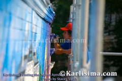 karlisima_on_scaffold_painting_the_mama_ayeshas_restaurant_presidential_mural